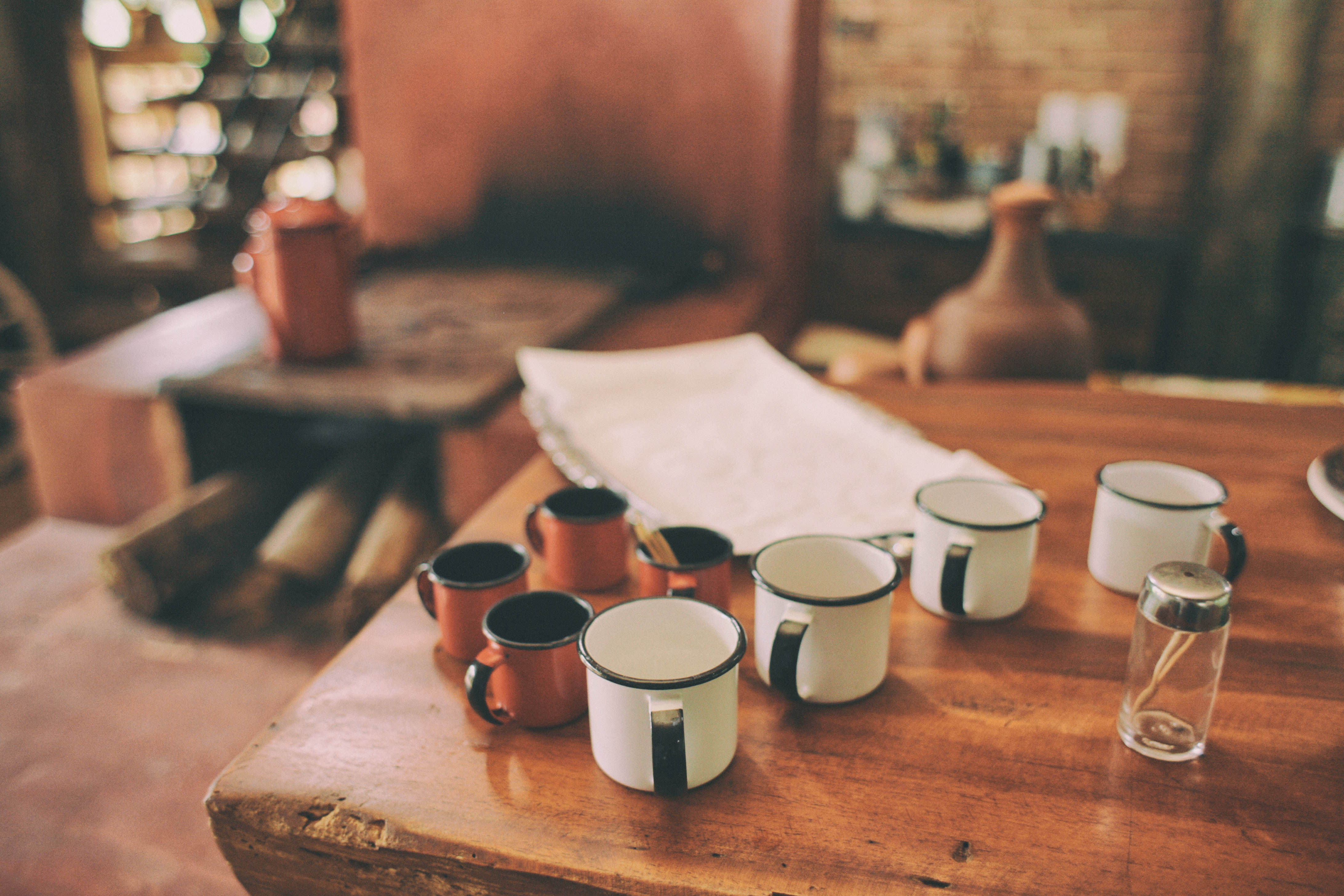 Barista carefully preparing a pour-over coffee at the brew bar